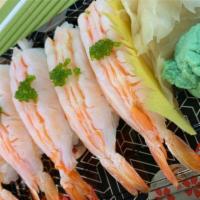 Ebi shrimp sushi · sushi rice top with fresh fish 

(5 pieces)