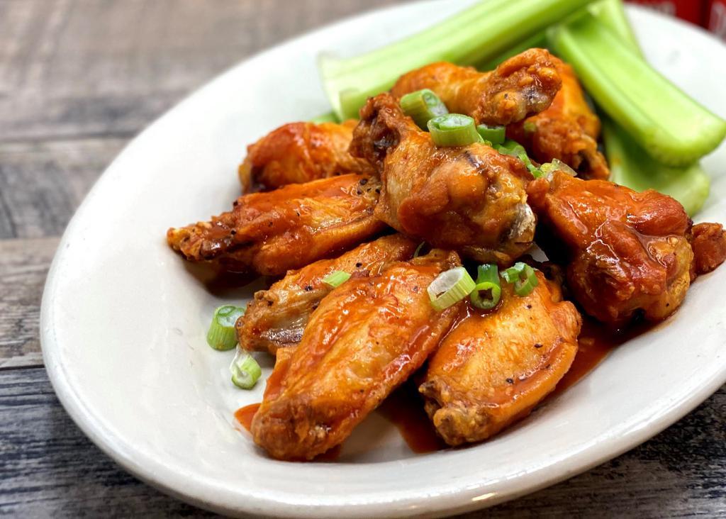 Brewpub Wings · One pound of chicken wings tossed in choice of sauce. Served with celery sticks and dipping sauce.