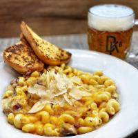 Hog Heaven Mac 'N Cheese · Bacon, porter pulled pork, smoked ham, and roasted garlic with brown ale cheesesauce topped ...