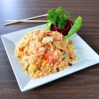 #61. Seafood Fried Rice · Combo seafood with pineapple, cashew nuts, eggs, onions, raisins, and tomatoes.