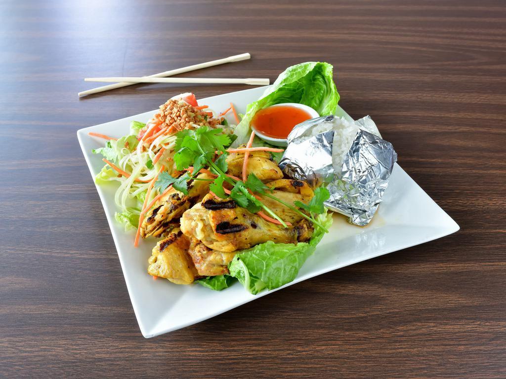 #2. Chicken Peanut Sauce Plate · Steamed sliced chicken on a bed of spinach topped with peanut sauce.