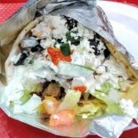 Chicken and Lamb Gyro (Combo) Sandwich · served in a pita with lettuce, tomato, onion, cucumber, white sauce, and hot sauce.