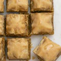 Baklava  · Layers of phyllo dough with pistachio and honey. (Three pieces)