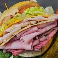 Americana Sandwich · Ham, turkey, roast beef, American and Swiss cheeses, lettuce, tomatoes and coleslaw.