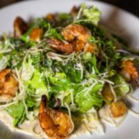 Classic Caesar Salad · Romaine, Parmesan, Garlic Herb Croutons tossed in our house made Caesar Dressing