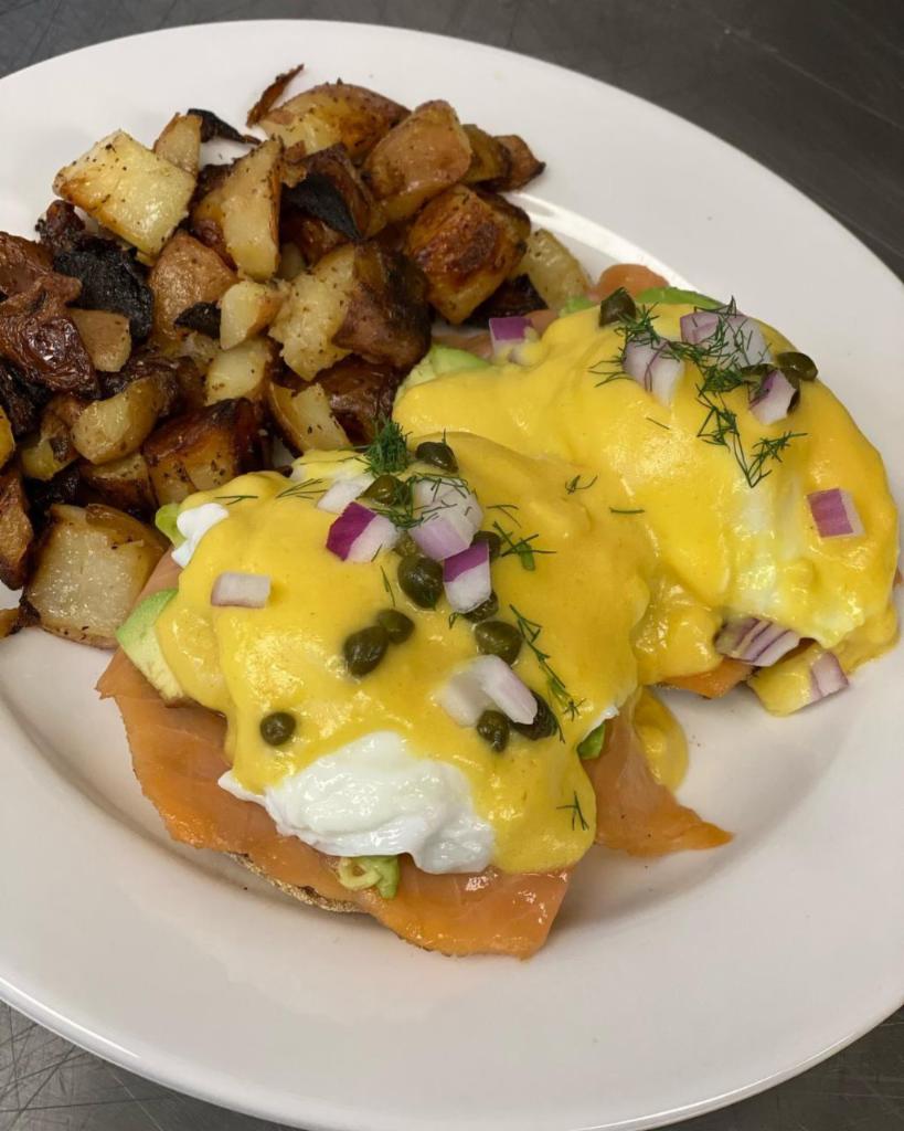 Smoked Salmon Benedict · 2 poached eggs, on an English muffin, smoked salmon, hollandaise sauce, capers, red onion and dill.