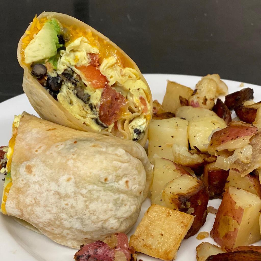 The Breakfast Burrito · A large flour tortilla stuffed with chourico, scrambled eggs, black beans, avocado, house made pico di gallo and cheddar jack cheese served with home fries.
