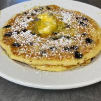 Lemon Ricotta Pancake · Our buttermilk pancake mix with ricotta and fresh lemon zest topped with whipped cream and p...