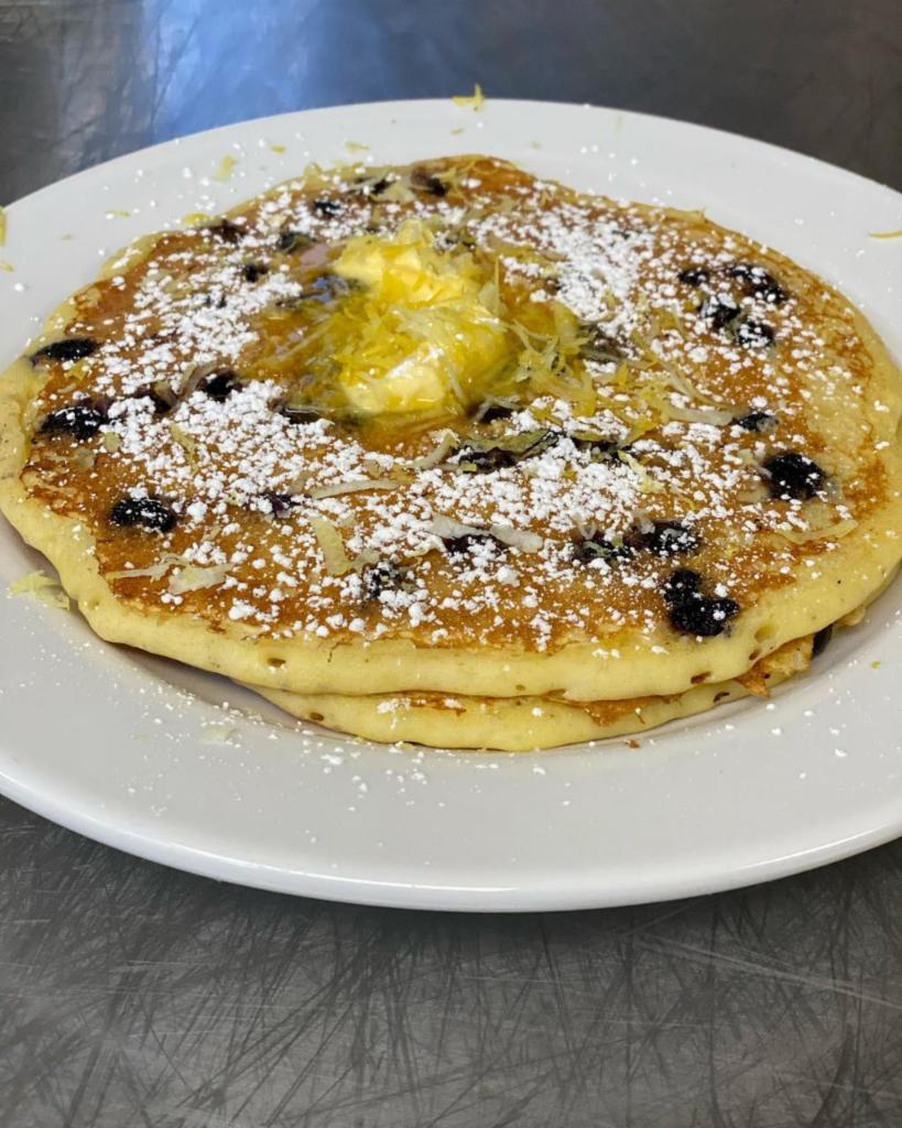 Lemon Ricotta Pancake · Our buttermilk pancake mix with ricotta and fresh lemon zest topped with whipped cream and powdered sugar.