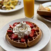 Girard's Belgian Waffle · Belgian waffle topped with fresh strawberries, powdered sugar and whipped cream, served with...
