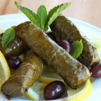 Grape Leaves (4) · Hand-rolled grape leaves stuffed with seasoned ground beef and rice 