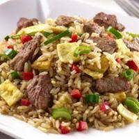 Beef Arroz Chaufa · Stir fry rice with vegetables, including Chinese onions, eggs, soy sauce with beef quickly c...