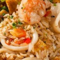 Seafood Arroz Chaufa · Stir fry rice with vegetables, including Chinese onions, eggs, soy sauce seafood calamari an...