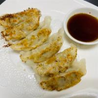 Gyoza · Pork, chicken and cabbage with soy vinaigrette sauce