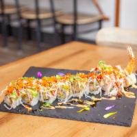 Maroon Roll · Tempura shrimp with cucumber inside topped with avocado, crab meat, tobiko and scallion.
