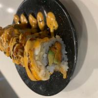 Tokyo Roll · Spicy tuna avocado tempura red snapper on top with spicy mayo, eel sauce and sweet chili sau...