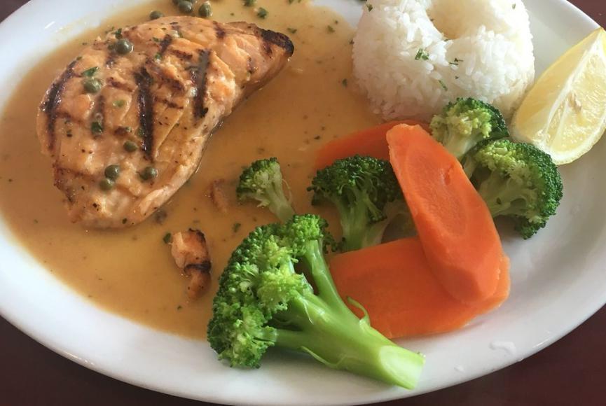 Grilled Salmon · Fresh filet of salmon grilled and topped with a white caper sauce. Served with jasmine rice and steamed vegetables.