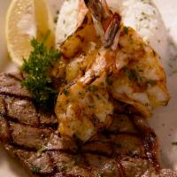 Mar y Tierra · 8 oz. New York steak served with 3 grilled large shrimp, served with jasmine rice and salad.