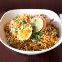 62. Biryani · Flavorful combination of meat, shrimp or egg and basmati rice cooked together with saffron a...