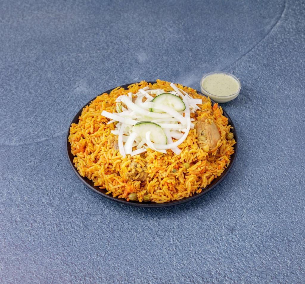 35. Chicken Biryani · Classic Muglai dish of chicken cooked in rice fragrance with saffron, chef's specialty. Hyderabadi style. Served with chef's special sauce and salad.