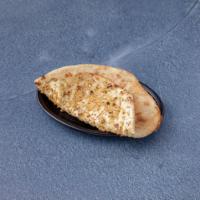 40. Garlic Naan · Traditional Punjabi bread of super fine flour with garlic.