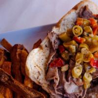 Italian Beef Sandwich Lunch · Served with hot or sweet peppers. Served with choice of side.