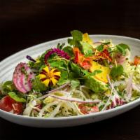 Chopped Vegetable Salad · Baby mix greens, corn, tomato, olives, avocado, beets, onions, cucumber, and oregano dressing.