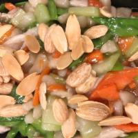 Chicken Almond Ding · Chicken, peapods, water chestnuts, mushrooms, carrots, bok choy and almonds. Served with whi...