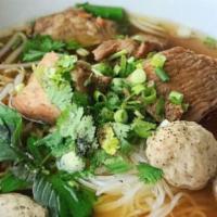 N2. Guay Tiew Moo Thoon · Braised pork noodle. Rice noodle soup with stewed pork and homemade pork ball.