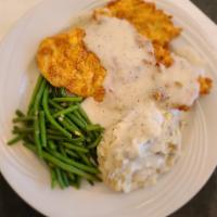 Chicken Fried Chicken · Hand battered boneless chicken breast,fried and topped with homemade cream gravy or our spic...