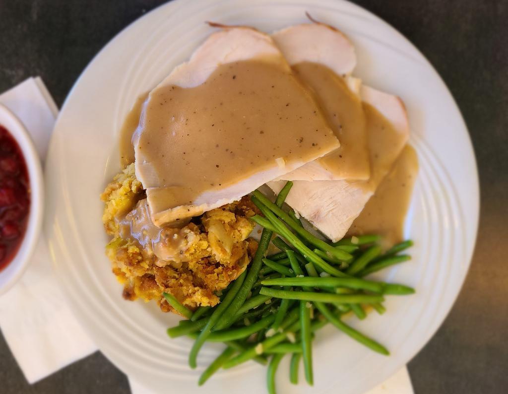 Roasted Turkey Breast Dinner · A generous portion of hand carved roasted turkey breast, served with our cornbread dressing and homemade turkey gravy.