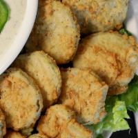 Fried Pickles · Black-eyed pea southern favorite. Golden fried pickle chips served with your choice of dippi...