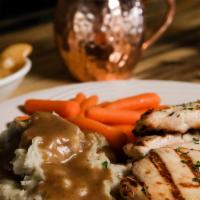 Grilled Chicken Breasts · 2 plump charbroiled chicken breasts served on a bed of rice.