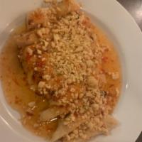 Thai Peanut Chicken · Grilled chicken served with Thai chili sauce and peanut. Spicy. 