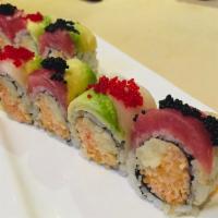 Christmas Roll · Spicy Kani crunchy cucumber inside topped with tuna, yellow tail, avocado and tobiko. 