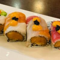 Fancy Roll · Spicy salmon crunch inside topped with tuna, salmon, yellowtail, white tuna, avocado, black ...