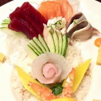 Chirashi  · 15 pieces of assorted sashimi with sushi rice. Choice of soup or salad.