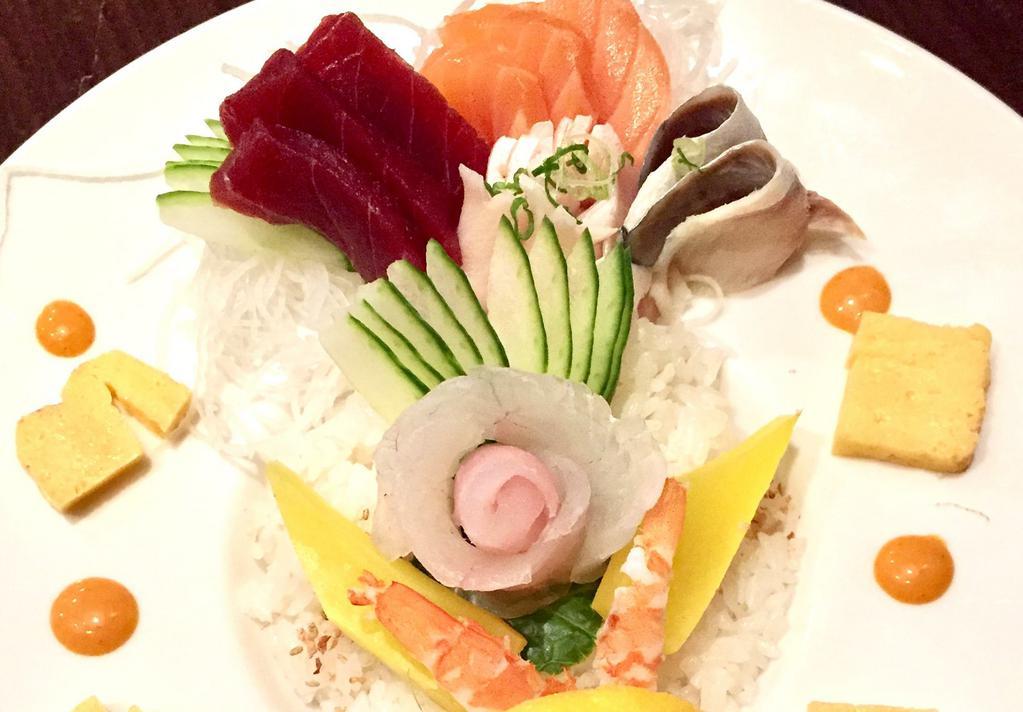Chirashi  · 15 pieces of assorted sashimi with sushi rice. Choice of soup or salad.