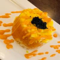 Spicy Salmon Tartare · Chop spicy salmon crunchy mixed dice mango and black tobiko on top.
