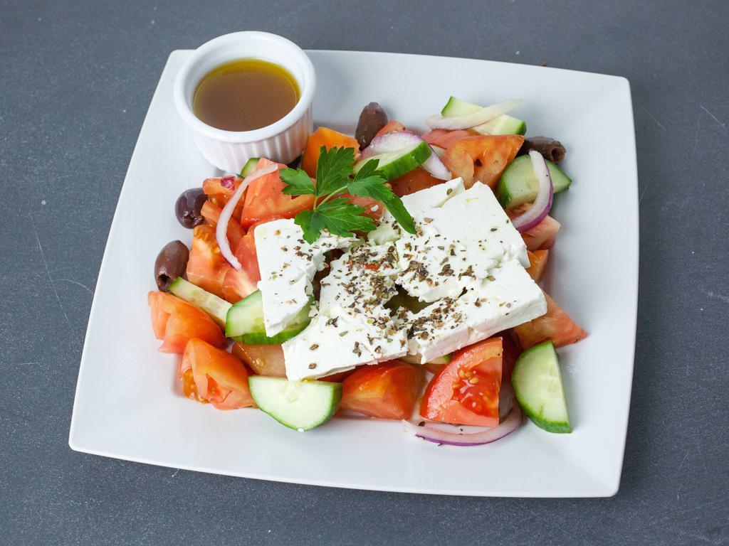 Greek Salad · Heirloom tomato, cucumber, red onion, feta cheese, kalamata olives, red wine vinaigrette