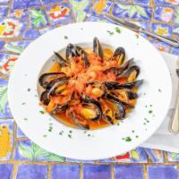 Mussels Marinara · Mussels sautéed in marinara sauce with fresh picked basil