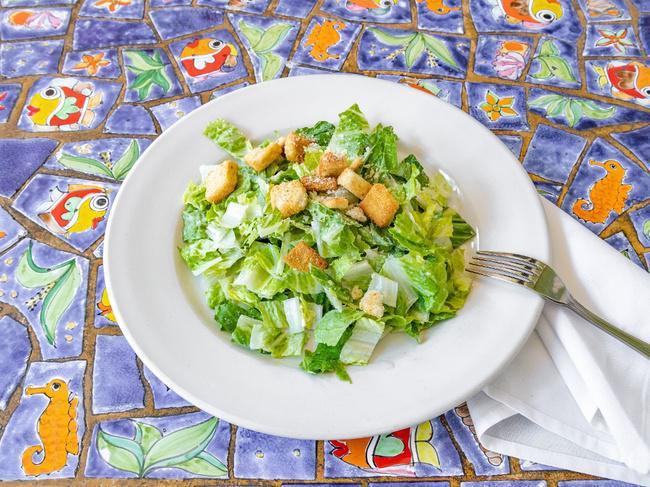 Caesar Salad · Chopped romaine lettuce tossed with our creamy caesar dressing and homemade croutons