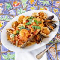 Zuppa di Pesce · Clams, mussels, shrimp, bay scallops & calamari sautéed with fresh tomatoes served over ling...