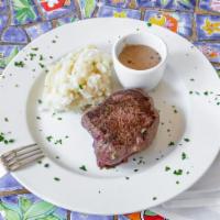 Filet Mignon · Served in a creamy peppercorn sauce served with mashed potatoes