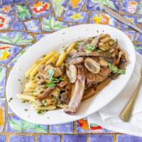 Veal Chop · 14 oz veal chop with sautéed shiitake & porcini mushrooms in a marsala wine sauce served w/ ...