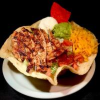 Fajita Taco Salad · Choice of fajita served in a taco shell with lettuce, tomato, guacamole, sour cream and shre...