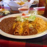 Enchiladas Plate · 2 beef or cheese enchiladas topped with chili con crane. Served with Spanish rice and beans.