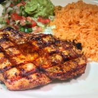 Pollo al Carbon · Marinated chicken breast charbroiled to tender perfection. Served with guacamole, Spanish ri...