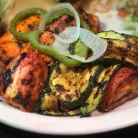 Vegetable Fajitas for 1 · A vegetarian delight. Marinated and grilled fresh zucchini, carrots, onions, bell peppers, t...