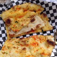 Garlic Naan · Naan baked with freshly chopped garlic and topped with cilantro.